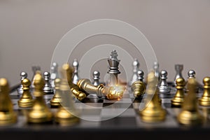 Silver and gold chess on the board.Business investment finance marketing planning concept