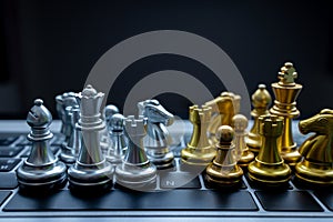 Silver and Gold chess on laptop, Marketing or business strategy, Chess battle victory success, Team leader teamwork business
