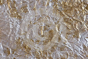 Silver-gold wrinkled background. Abstract background