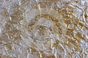 Silver-gold wrinkled background. Abstract background