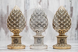 Silver and Golden Religious Statuettes with the Names of Allah