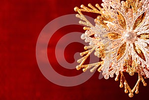 Silver-golden snowflake on red