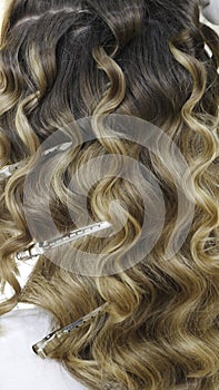 Silver hairdressers clips in wavy hair