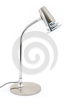 Silver halogen desk lamp over white