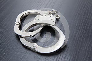 Silver handcuffs detaining crime prisoners