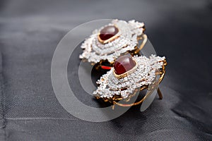Silver handmade earrings with red ruby and gold outlined