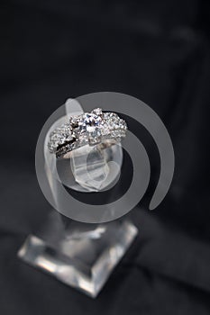 Silver handmade ring with diamonds on a black background