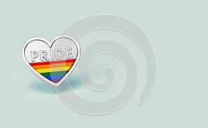 Silver heart with rainbow and word PRIDE inside. Month of pride concept. Isolated on pastel green background with copy space. 3D