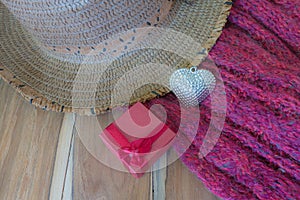Silver heart, scarve, hat on wooden background decorated photo