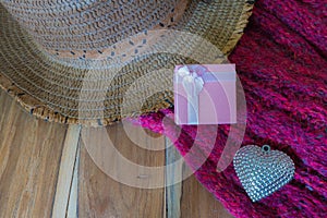Silver heart, scarve, hat on wooden background photo