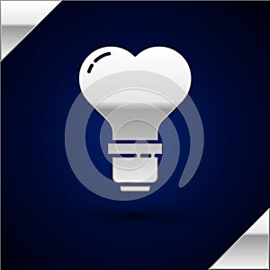 Silver Heart shape in a light bulb icon isolated on dark blue background. Love symbol. Valentine day symbol. Vector