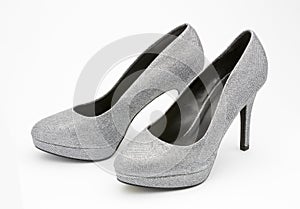 Silver high heeled party shoes.