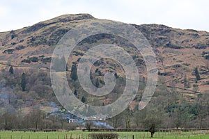 Silver How viewed over lake from above Dove Cottage, Grasmere, Cumbria, England, UK