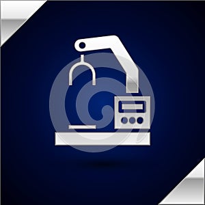 Silver Industrial machine robotic robot arm hand factory icon isolated on dark blue background. Industrial robot