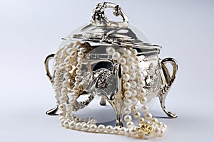 Silver jewelery box with pearls photo