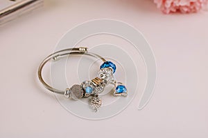 Silver jewelry bracelet with beads on a white background