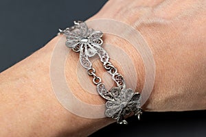 Silver Jewelry - Bracelet on a woman's hand close up