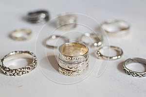 Silver jewelry on a soft white background. Handcraft elegant silver rings