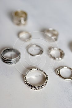 Silver jewelry on a soft white background. Handcraft elegant silver rings