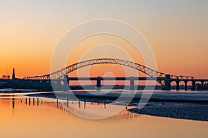 Silver Jubilee Bridge in Runcorn with the sun setting in the background