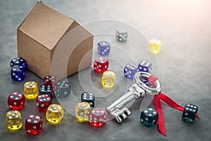 Silver key with colorful glass dice