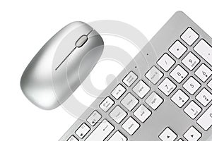 silver keyboard and mouse on white isolated background