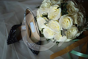 Silver lace high heel with white rose bouquet composed with vei