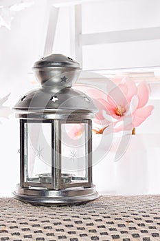 Silver Lantern with white light background can be used for Ramadan wishing designs and greeting card