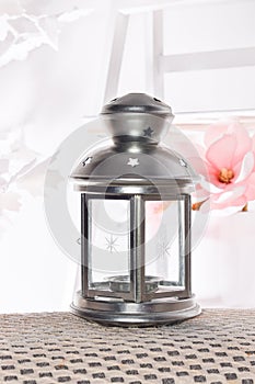 Silver Lantern with white light background can be used for Ramadan wishing designs and greeting card