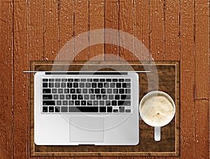 Silver Laptop and Coffee on Brown Wood Table Copyspace Blog