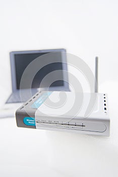 Silver Laptop and wireless router