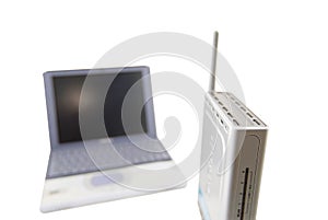 Silver Laptop and wireless router