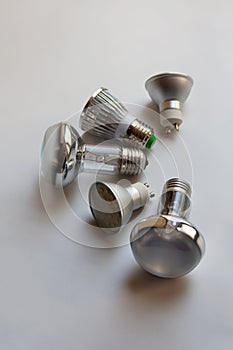 Silver light bulbs on white background