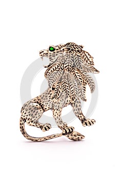 Silver lion brooch isolated on white