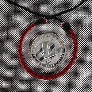 Silver Litcoin and red bracelet