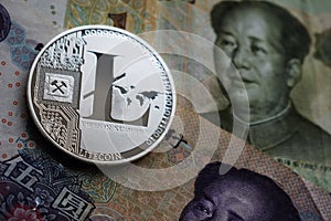 Silver Litecoin LTC on Chinese Yuan banknote photo