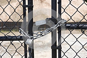 Silver Lock and Chain on Black Gate
