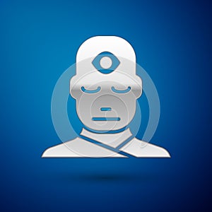 Silver Man with third eye icon isolated on blue background. The concept of meditation, vision of energy, aura. Vector