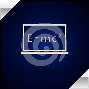Silver Math system of equation solution on chalkboard icon isolated on dark blue background. E equals mc squared