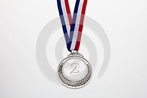 Silver medal. Champion trophy award and ribbon. Prize in sport for second place isolated on white