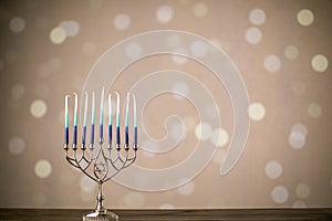 A silver menorah for the Jewish holiday Hanukkah with eight unlit candles