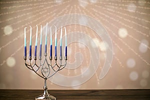 A silver menorah for the Jewish holiday Hanukkah with eight unlit candles