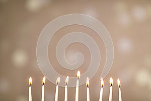 A silver menorah for the Jewish holiday Hanukkah with eight unlit candles