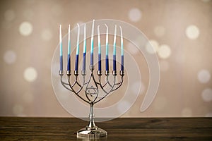 A silver menorah for the Jewish holiday Hanukkah with eight unlit candles