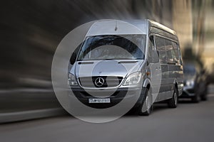 Silver Mercedes Benz Sprinter van.