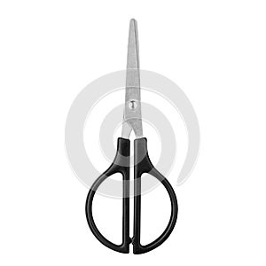 Silver metal closed scissors with black plastic handles on white background isolated close up, steel cutting tool for paper