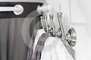 Silver Metal Hooks with White and Grey Towels