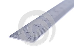 Silver metal ruler with focus first two centimeters. With white background.