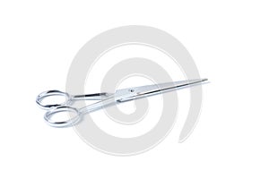 Silver metal scissors for haircut on white background