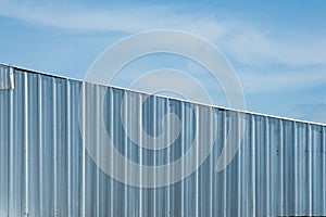 silver metal sheet wall, aluminium corrugate wall with blue sky